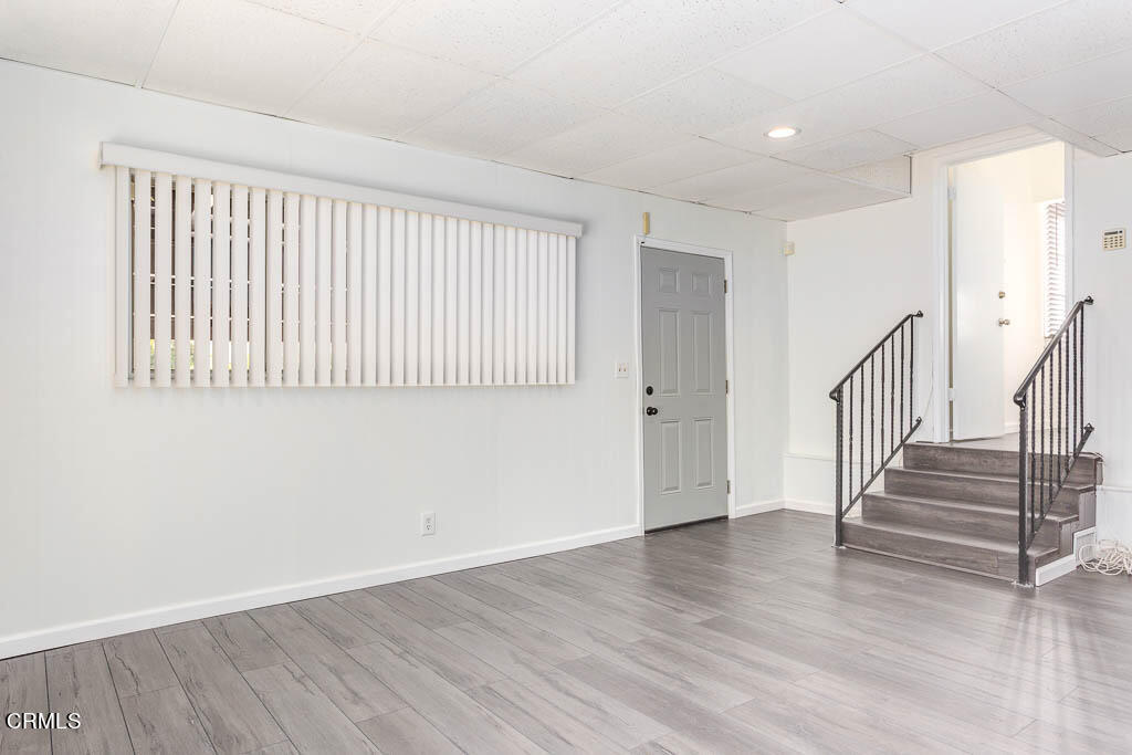 2452 Boulder Road Altadena, CA 91001 - Photo 25 of 33 a view of an empty room with wooden floor and a window