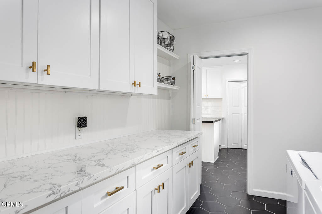 2452 Boulder Road Altadena, CA 91001 - Photo 27 of 33 a kitchen with granite countertop white cabinets and a sink