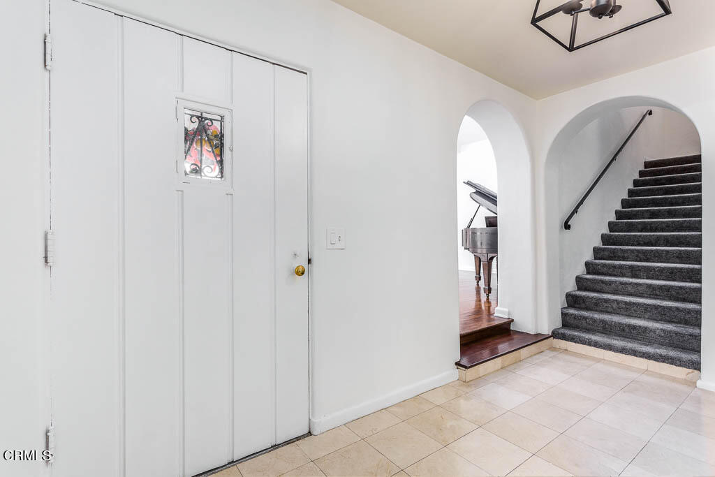 2452 Boulder Road Altadena, CA 91001 - Photo 7 of 33 a view of a livingroom with wooden floor and white walls
