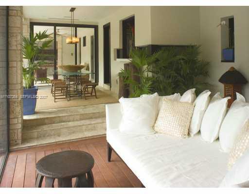 700 Lake Road Miami, FL 33137 - Photo 9 of 12 a living room with furniture and a floor to ceiling window