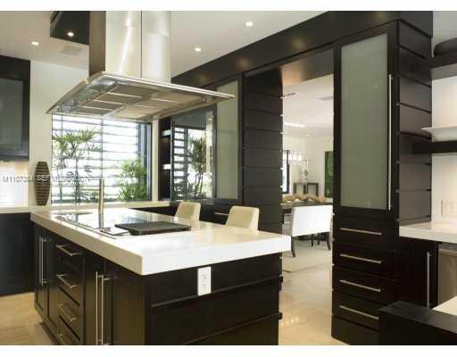 700 Lake Road Miami, FL 33137 - Photo 10 of 12 a kitchen with a sink and cabinets