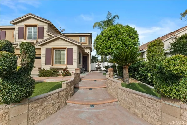 a kitchen with stainless steel appliances granite countertop a stove top oven a sink a dining table and chairs