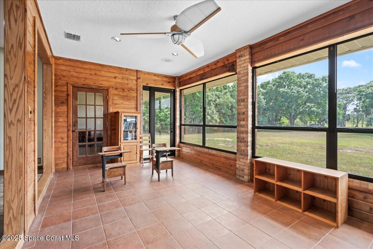 223 Deer Run Road Palm Bay, FL 32909 - Photo 11 of 41 a room with furniture and large windows