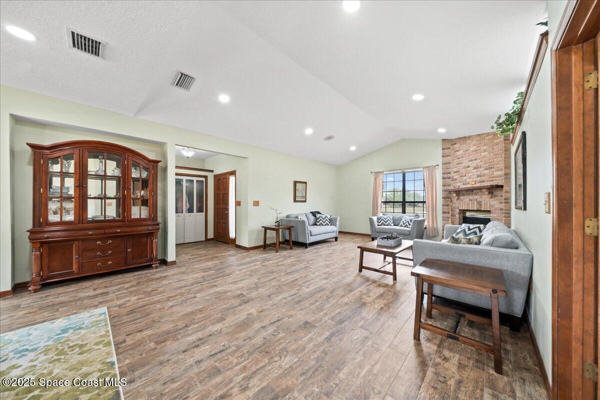 223 Deer Run Road Palm Bay, FL 32909 - Photo 41 of 41 a living room with furniture and wooden floor