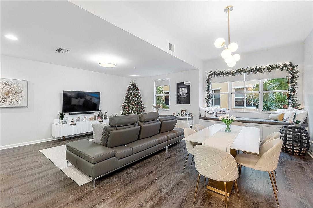 2330 Vintage Drive Lighthouse Point, FL 33064 - Photo 13 of 41 a living room with furniture a flat screen tv and a lamp
