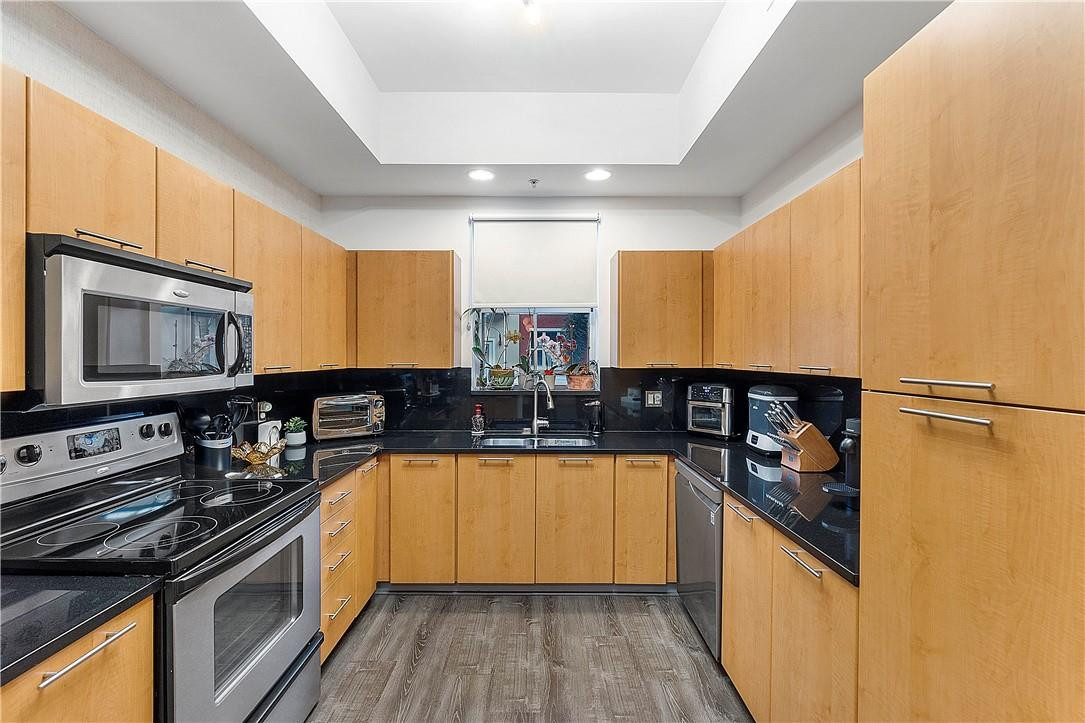 2330 Vintage Drive Lighthouse Point, FL 33064 - Photo 18 of 41 a kitchen with stainless steel appliances a stove sink and refrigerator