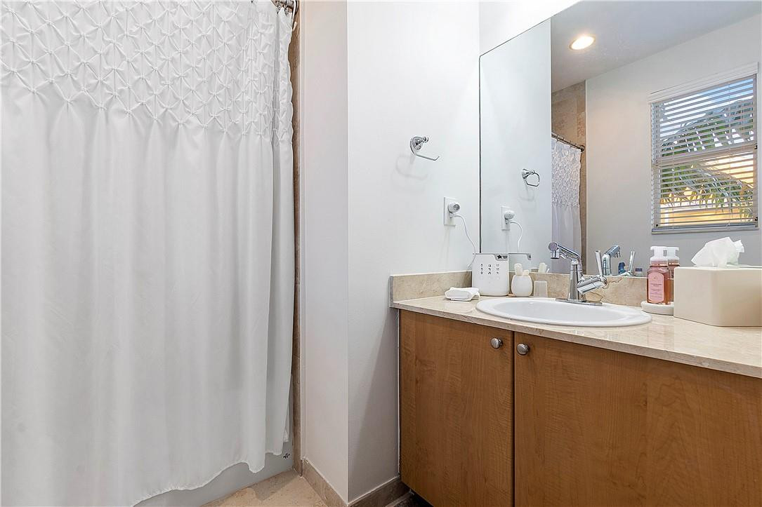 2330 Vintage Drive Lighthouse Point, FL 33064 - Photo 27 of 41 a bathroom with a double vanity sink and mirror