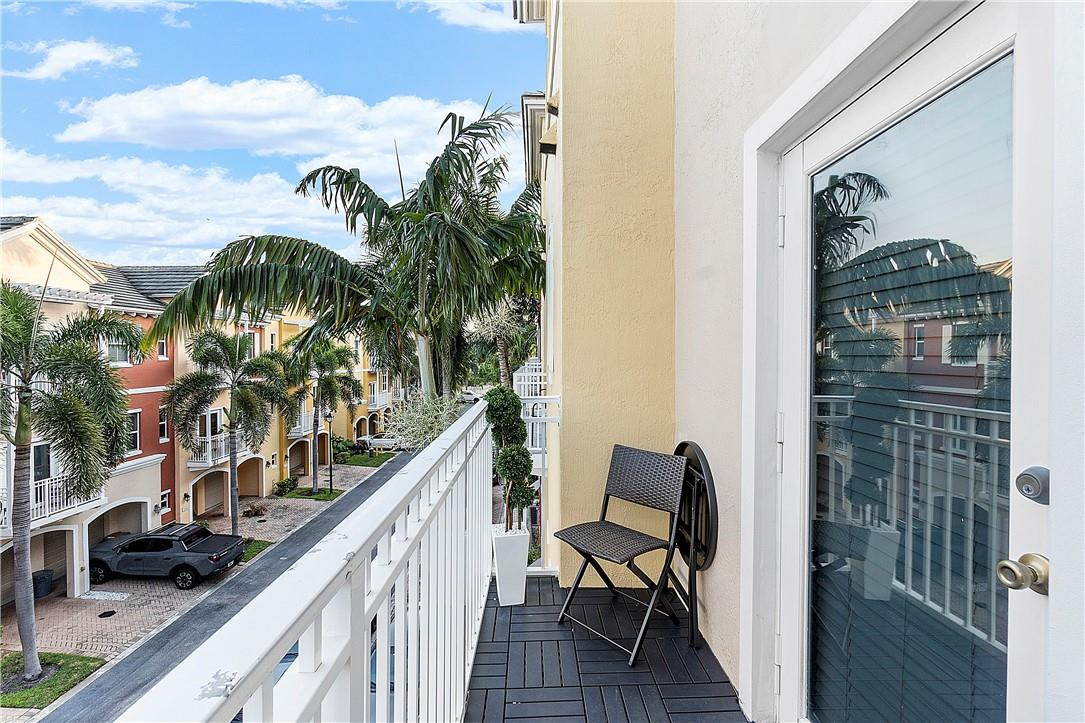 2330 Vintage Drive Lighthouse Point, FL 33064 - Photo 29 of 41 a balcony with outdoor seating and city view