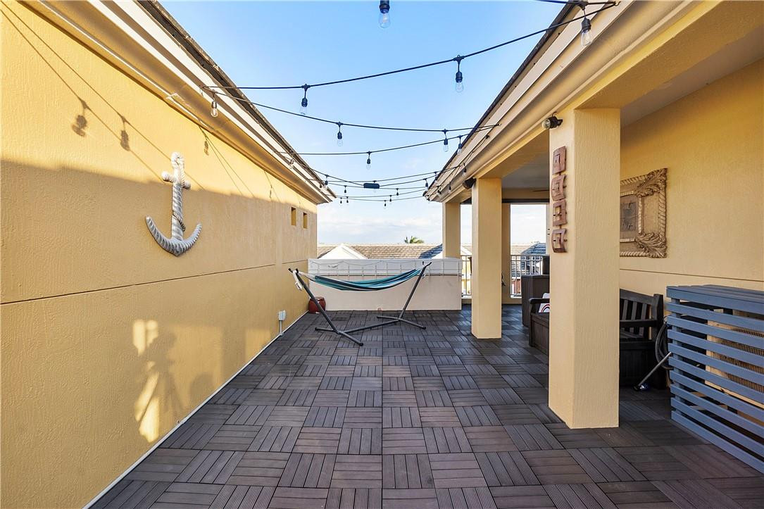 2330 Vintage Drive Lighthouse Point, FL 33064 - Photo 34 of 41 a view of a porch with wooden floor and iron stairs