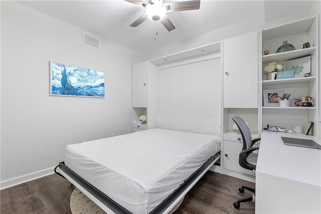 2330 Vintage Drive Lighthouse Point, FL 33064 - Photo 7 of 41 a bedroom with a bed and a chandelier