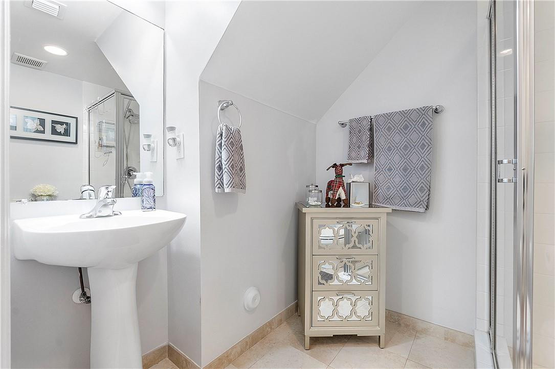 2330 Vintage Drive Lighthouse Point, FL 33064 - Photo 8 of 41 a bathroom with a sink a mirror and shower view