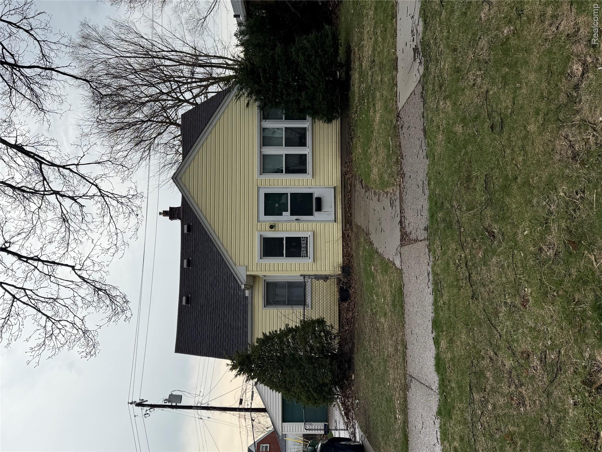 15834 Stephens Road Eastpointe, MI 48021 - Photo 1 of 1 Bungalow with a front yard and a chimney