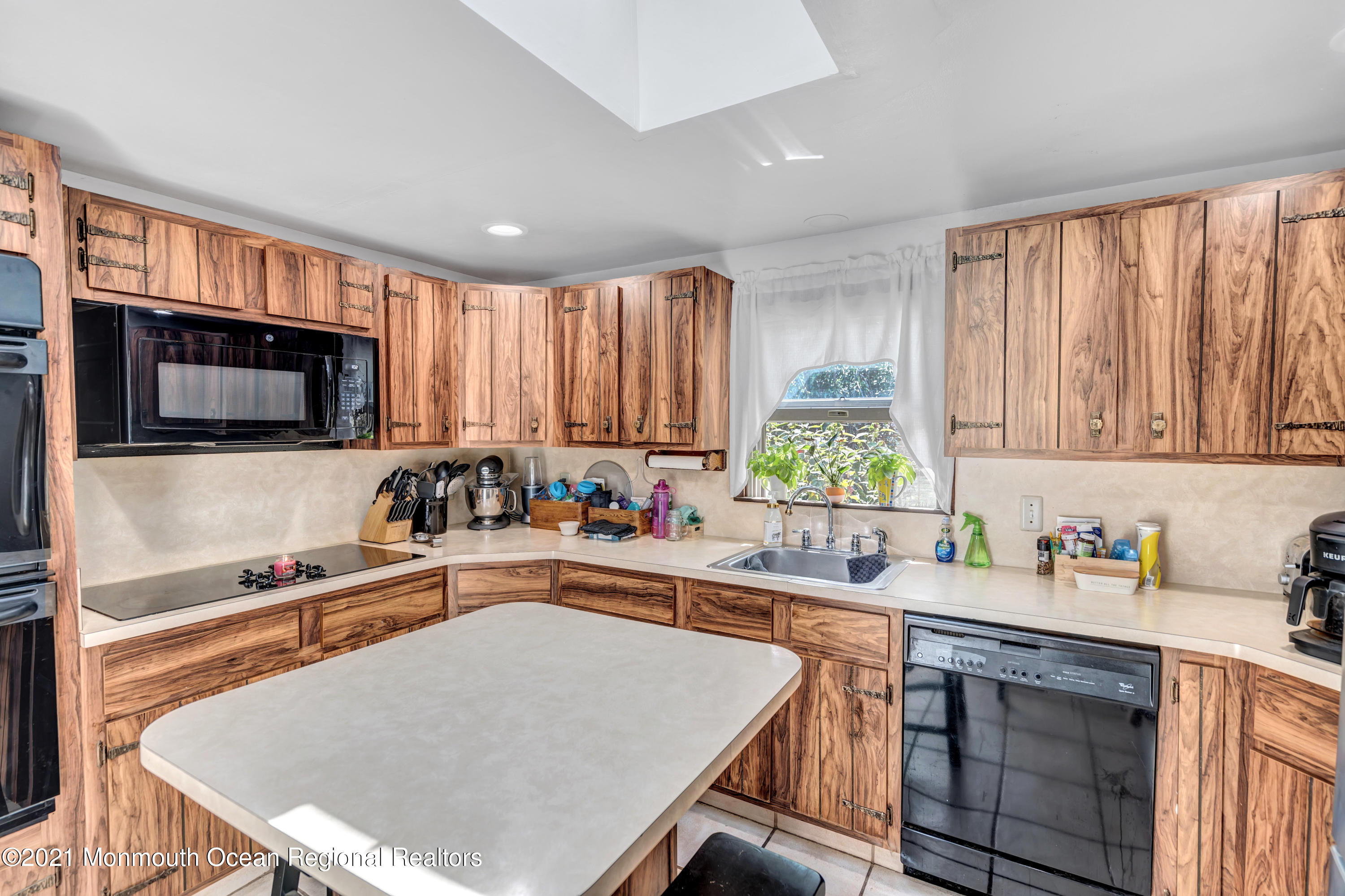 580 Hyson Road Jackson, NJ 08527 - Photo 12 of 45 a kitchen with a stove a sink a microwave a refrigerator and cabinets