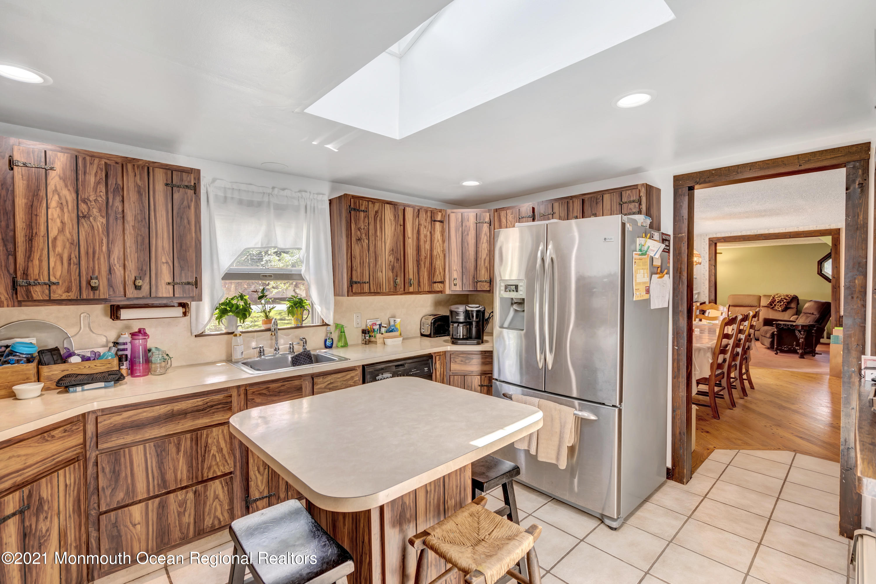 580 Hyson Road Jackson, NJ 08527 - Photo 13 of 45 a kitchen with a refrigerator a sink and a cabinets