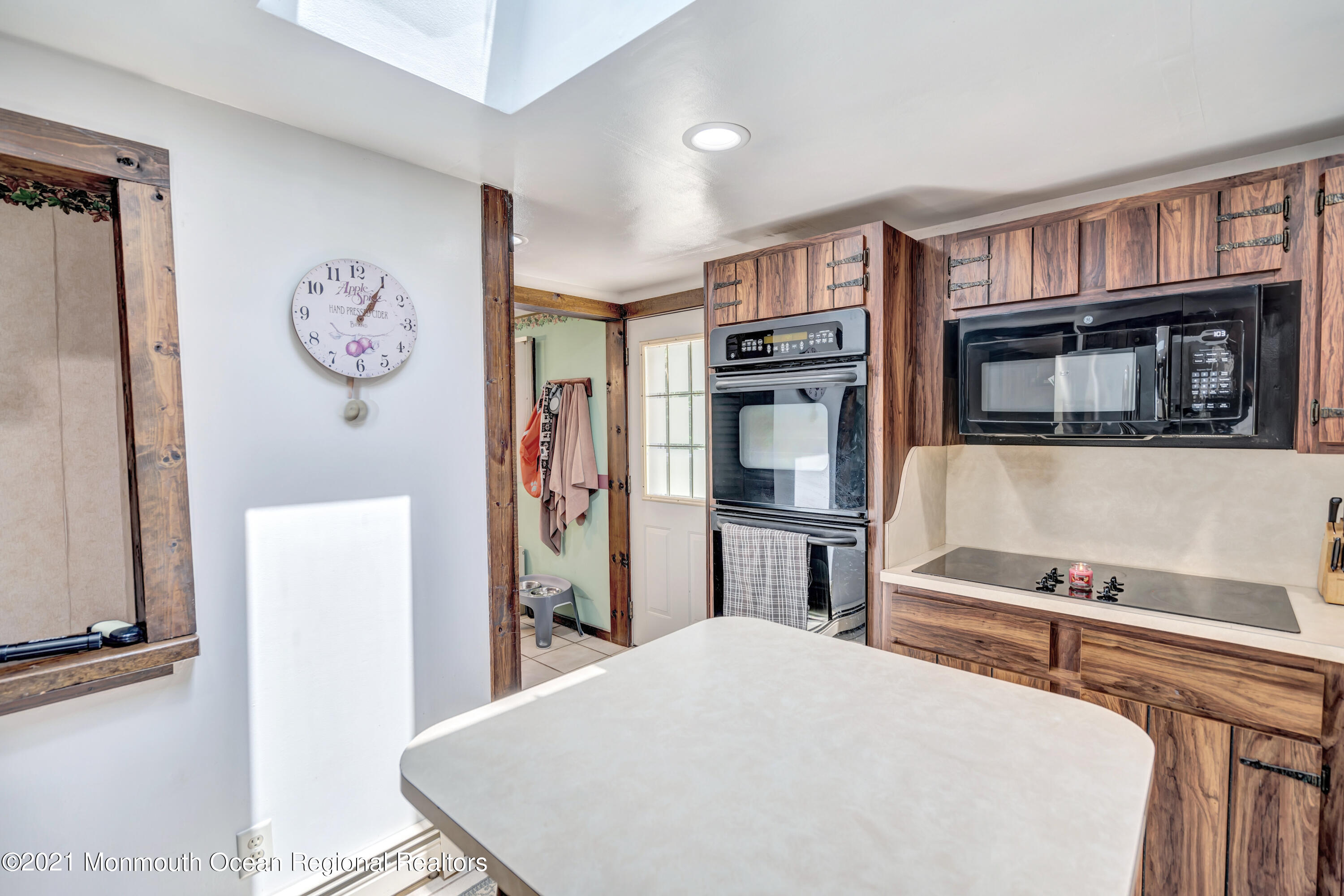 580 Hyson Road Jackson, NJ 08527 - Photo 15 of 45 a bedroom with a bed and a refrigerator