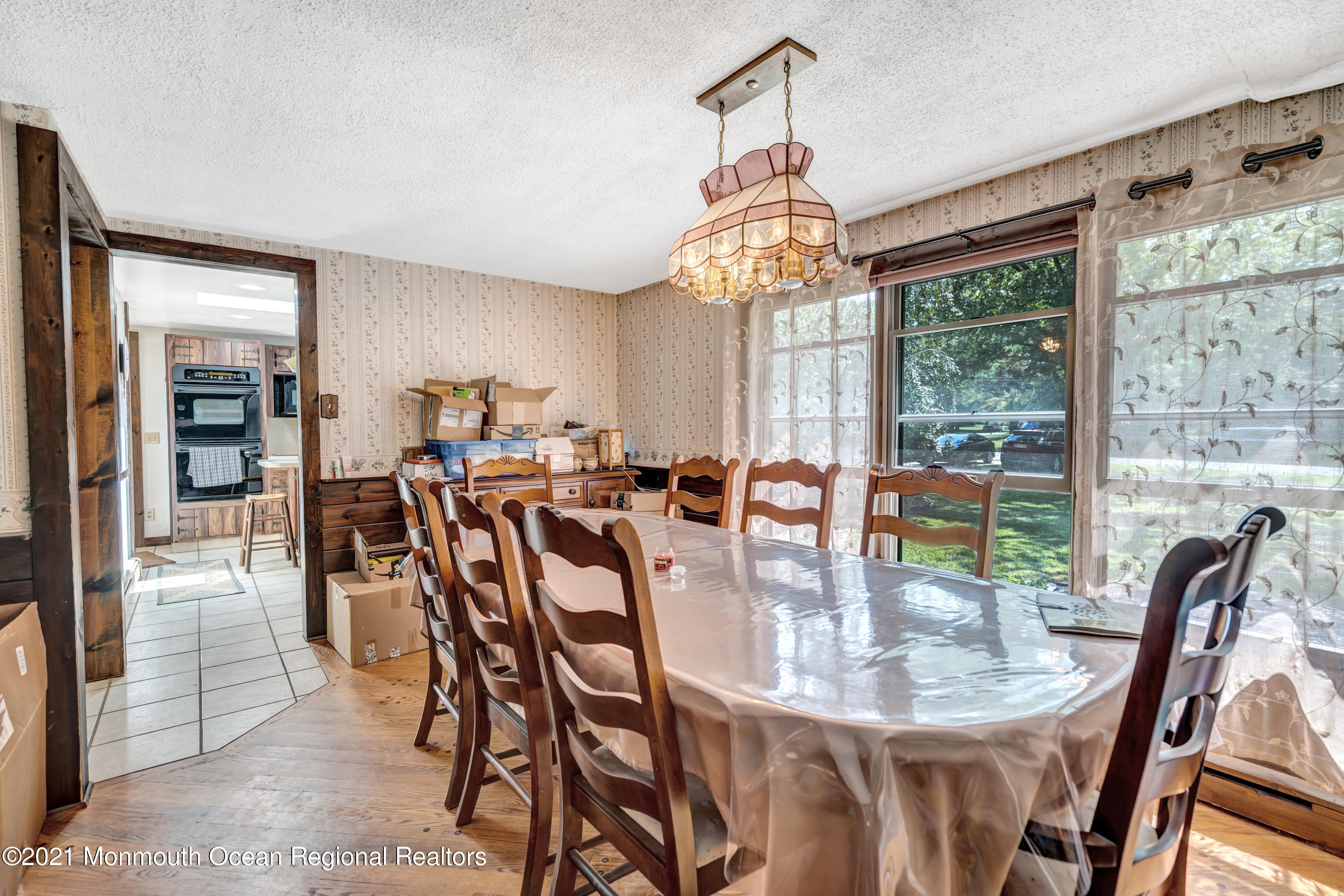 580 Hyson Road Jackson, NJ 08527 - Photo 20 of 45 a view of a dining room with furniture wooden floor and chandelier