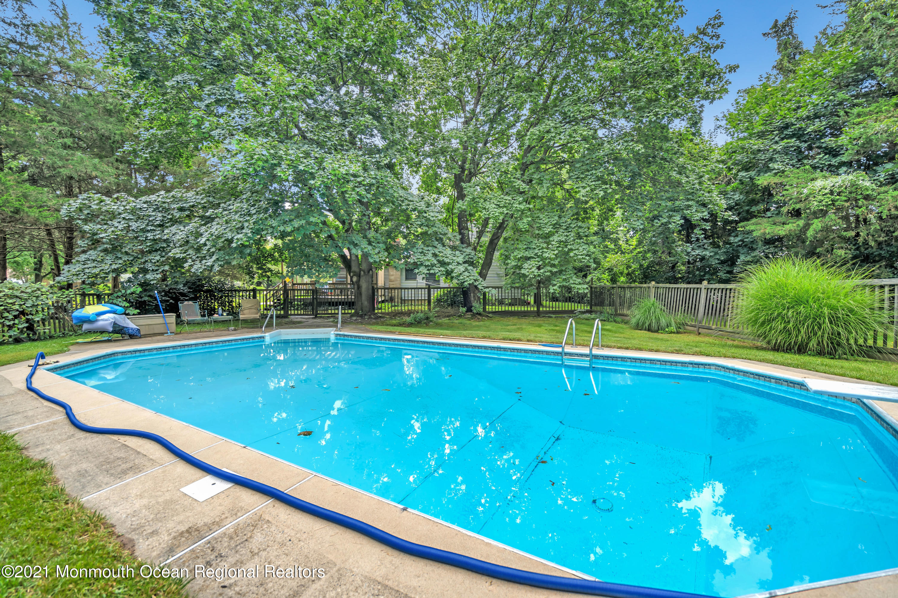 580 Hyson Road Jackson, NJ 08527 - Photo 21 of 45 a view of a swimming pool with a yard