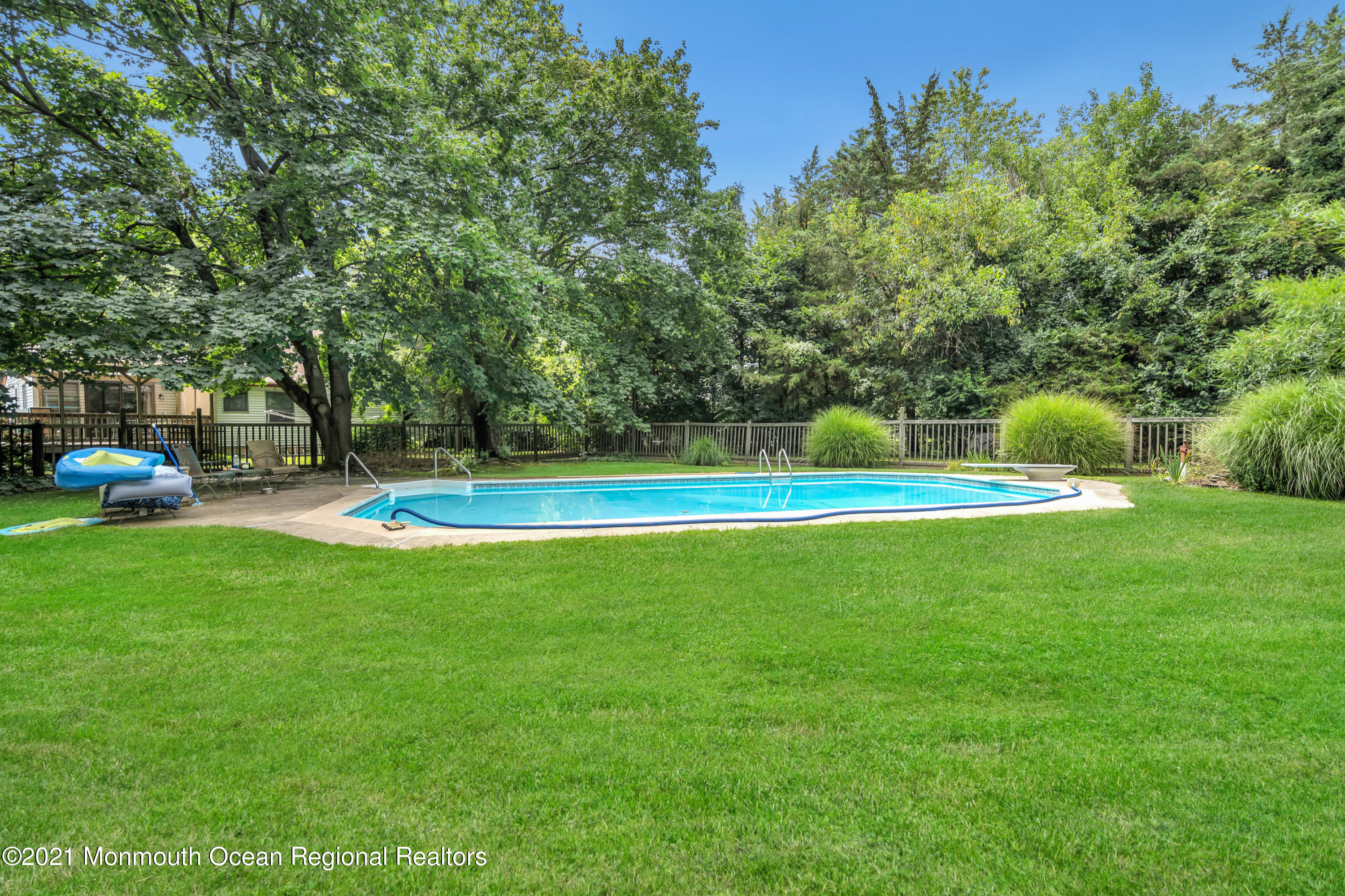 580 Hyson Road Jackson, NJ 08527 - Photo 29 of 45 a view of a swimming pool with a yard