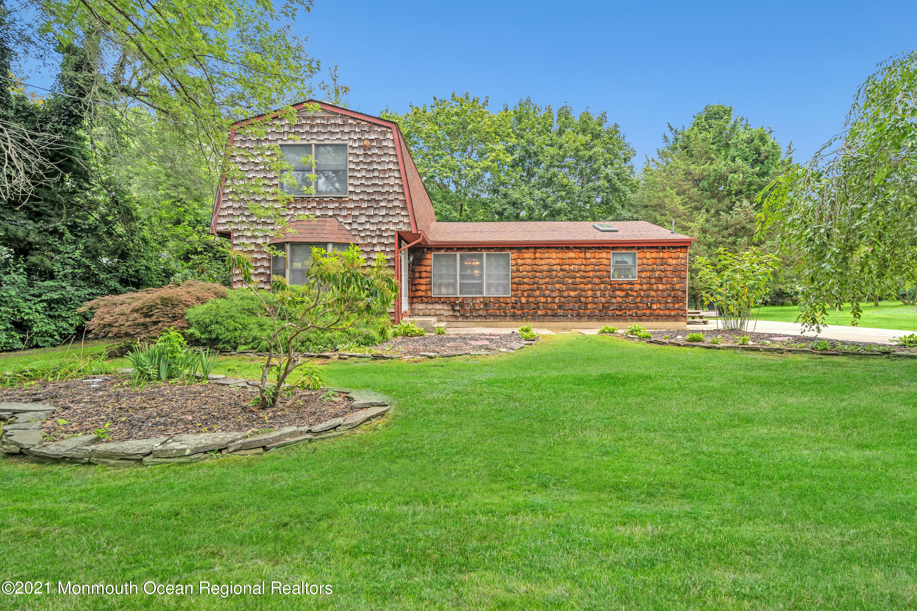 580 Hyson Road Jackson, NJ 08527 - Photo 5 of 45 a front view of a house with a yard