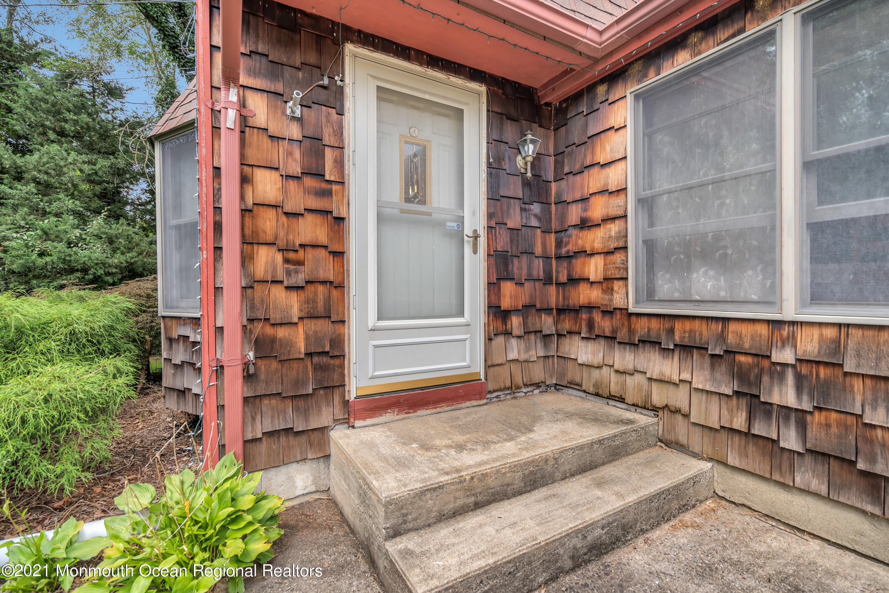 580 Hyson Road Jackson, NJ 08527 - Photo 6 of 45 a front view of a house with a garden