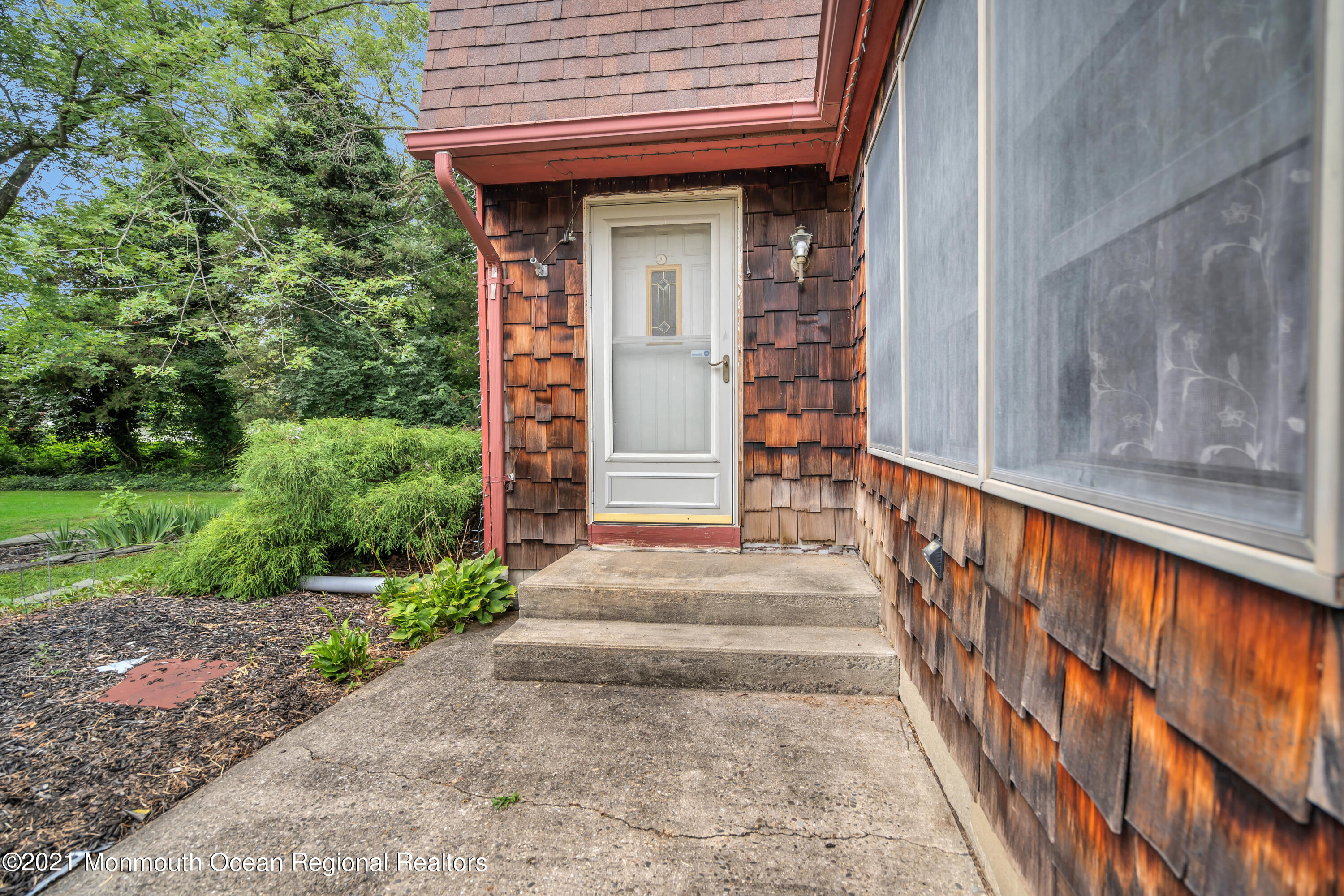 580 Hyson Road Jackson, NJ 08527 - Photo 7 of 45 a front view of a house with a garden
