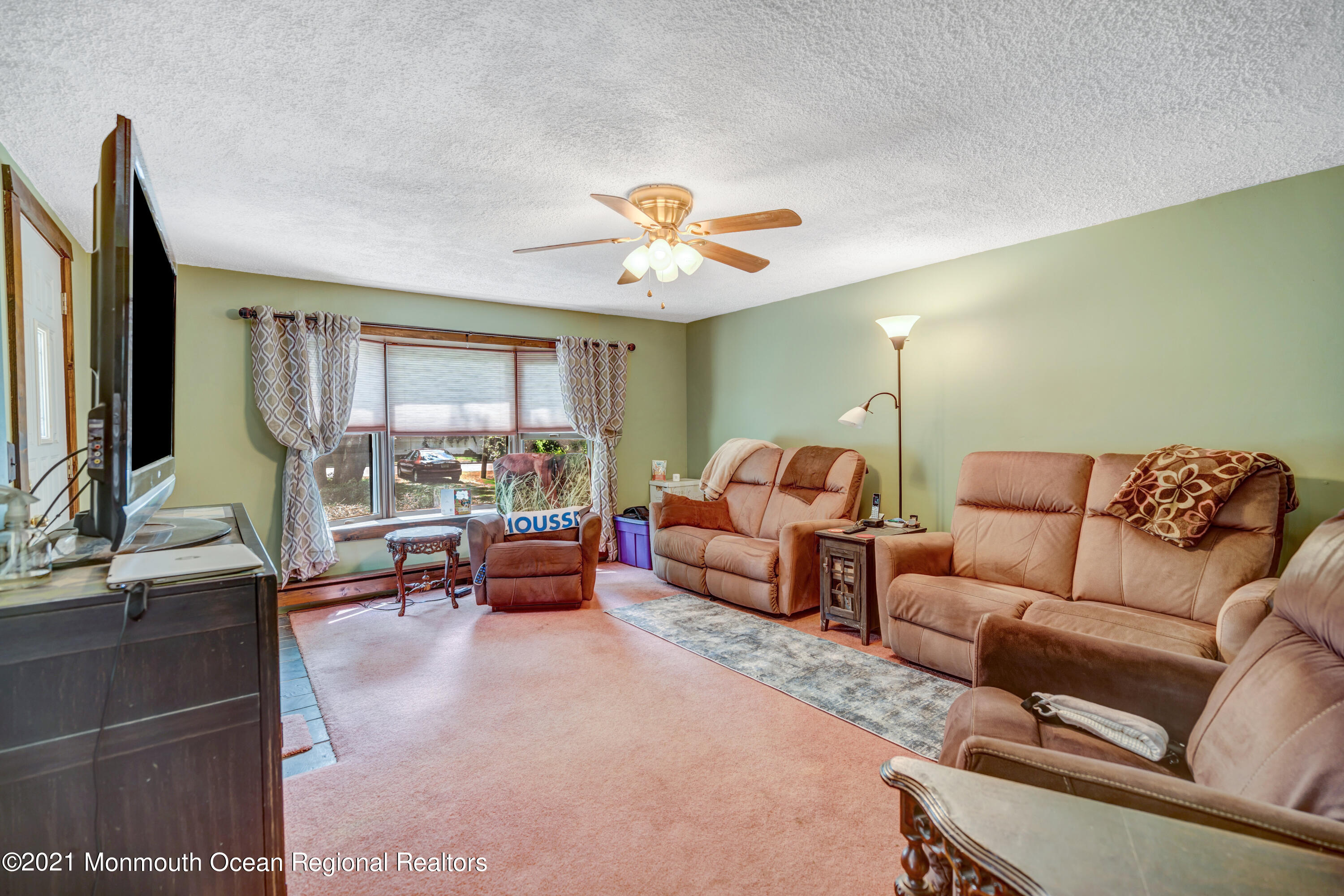 580 Hyson Road Jackson, NJ 08527 - Photo 8 of 45 a living room with furniture and a large window