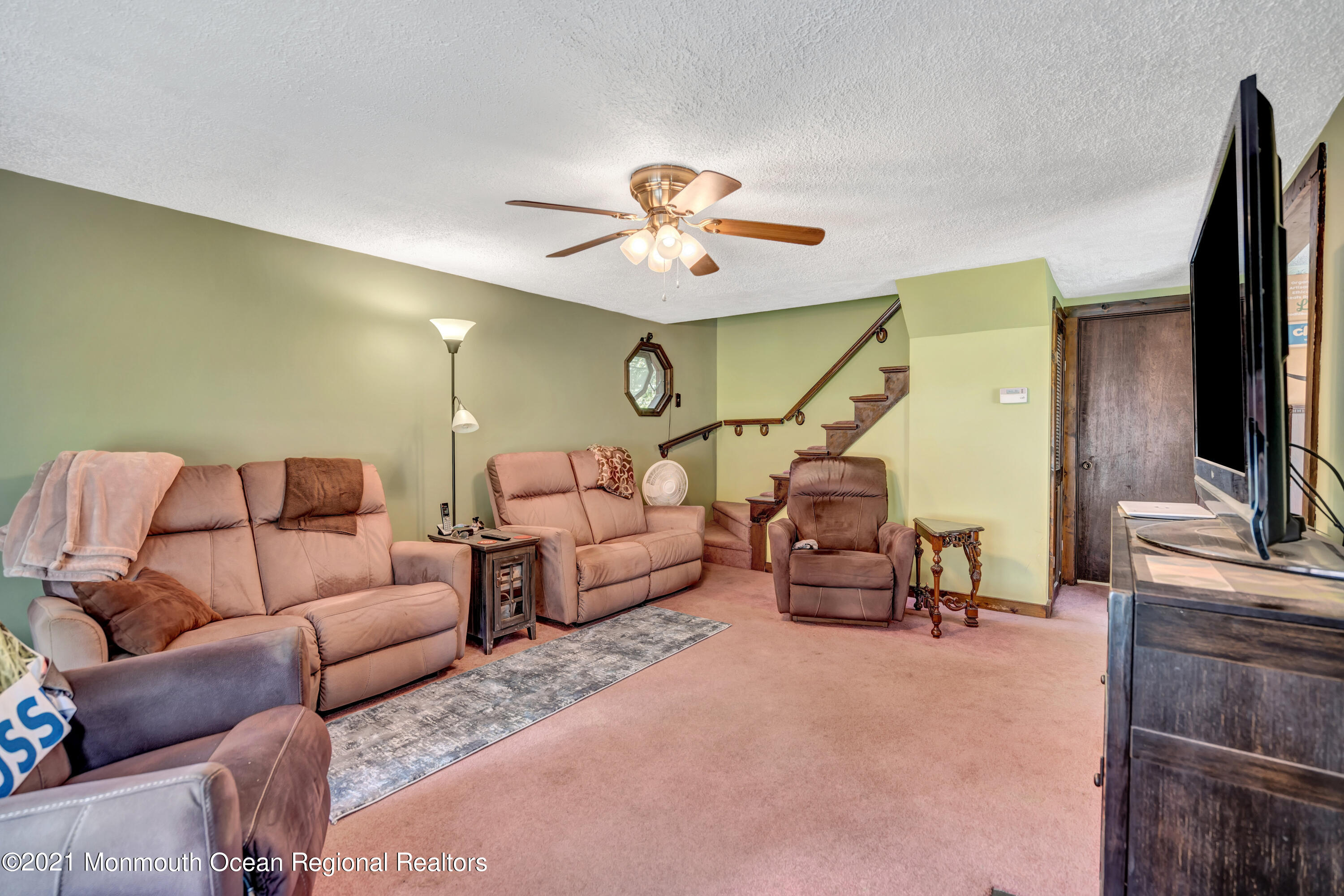 580 Hyson Road Jackson, NJ 08527 - Photo 9 of 45 a living room with furniture and a flat screen tv