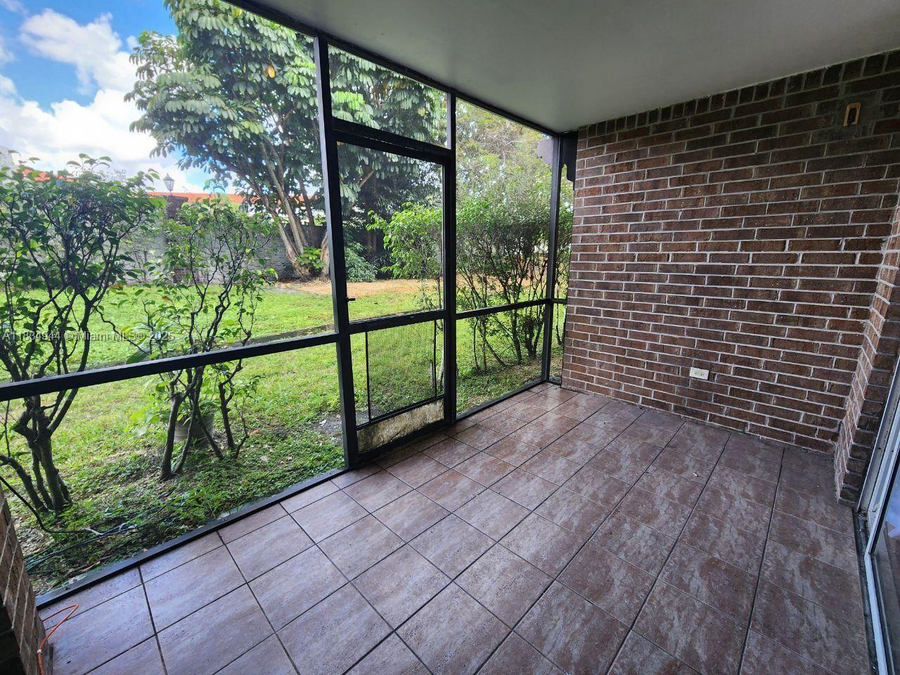 3690 Inverrary Drive, Unit 1T Lauderhill, FL 33319 - Photo 15 of 24 a view of a garden from a balcony
