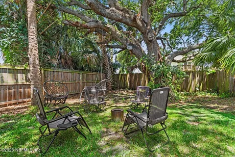 a view of a backyard with a patio