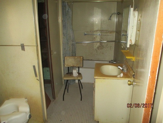 2661 New Clinton Road, Unit B17 Macon, GA 31211 - Photo 6 of 10 a bathroom with a granite countertop sink toilet and shower