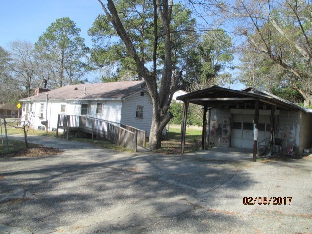 2661 New Clinton Road, Unit B17 Macon, GA 31211 - Photo 9 of 10 a front view of a house with a garden