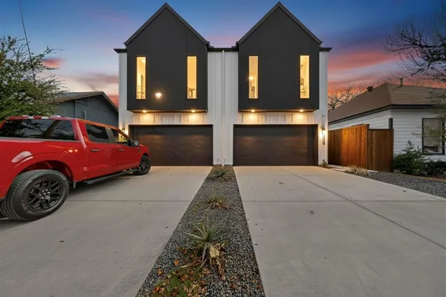 a front view of a house with parking space