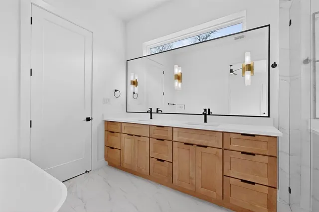 a white bath tub sitting in a bathroom