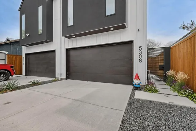 a front view of a house with garage