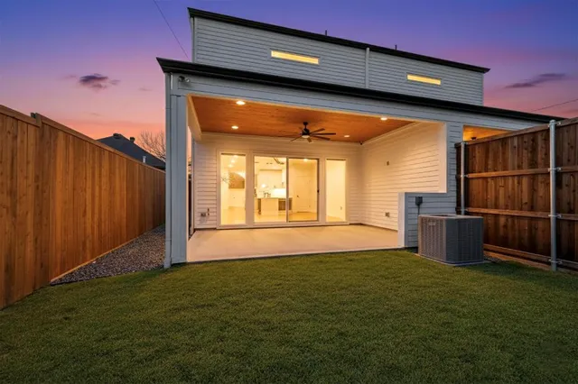 a view of a backyard with wooden fence