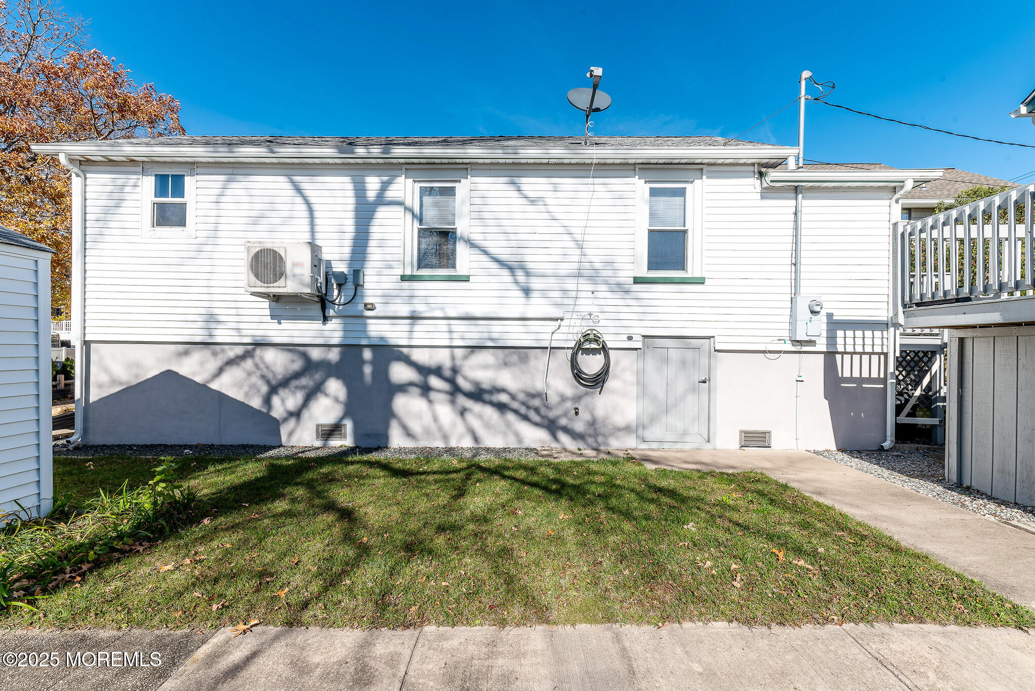 112 Ocean Gate Avenue Ocean Gate, NJ 08740 - Photo 11 of 15 a view of a house with backyard and sitting area