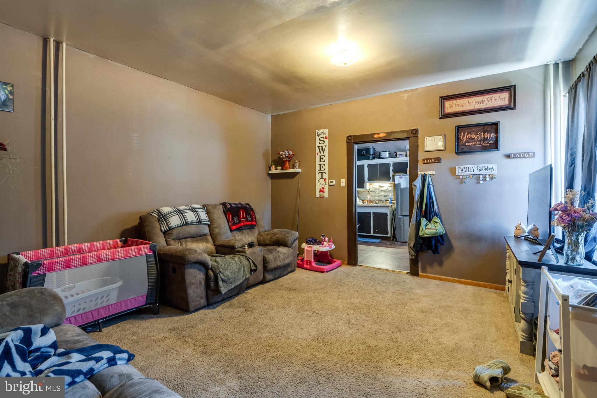 546 Poplar Street Lancaster, PA 17603 - Photo 12 of 29 a living room with furniture and a wooden floor