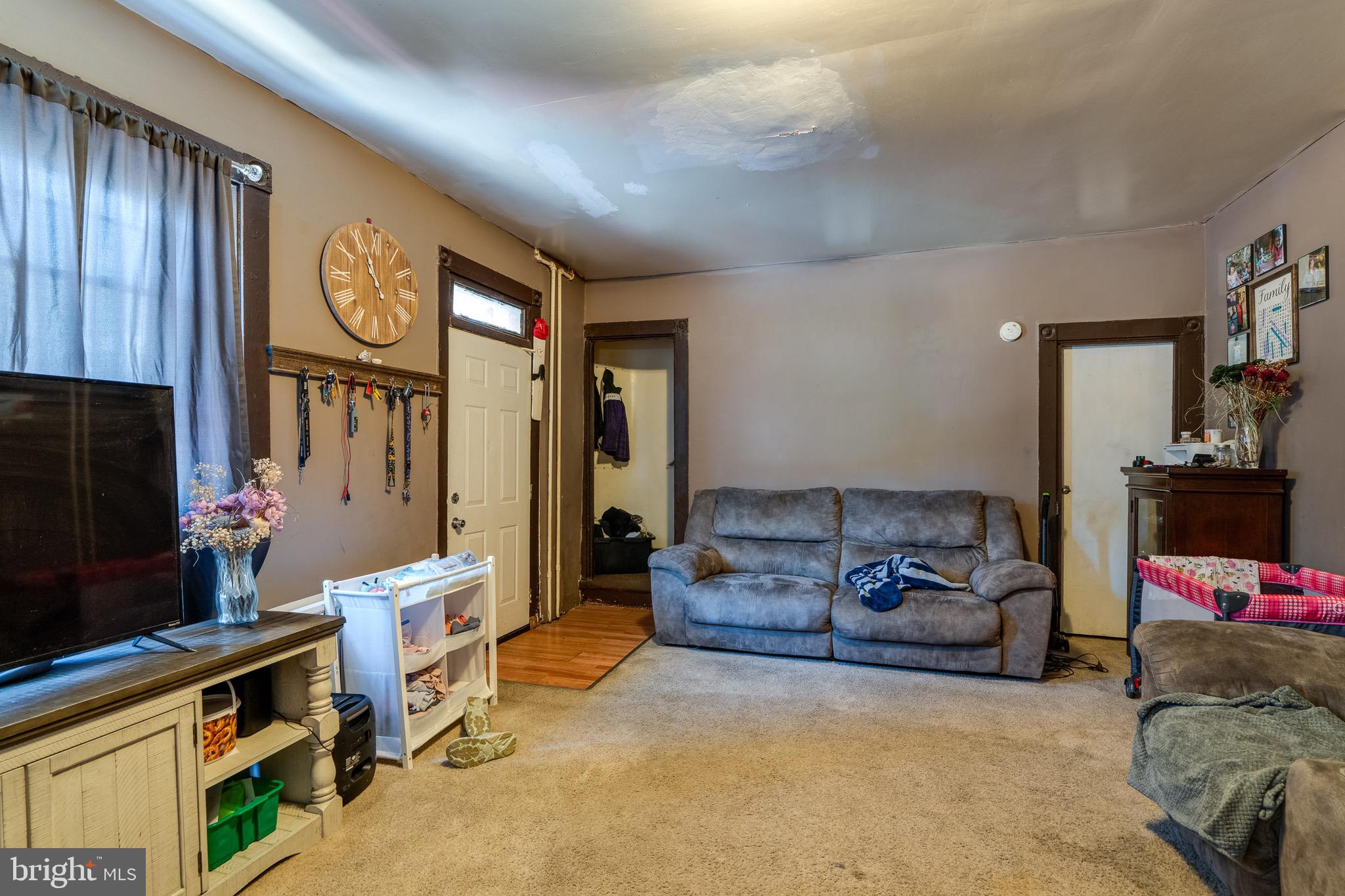 546 Poplar Street Lancaster, PA 17603 - Photo 13 of 29 a living room with furniture a flat screen tv and a fireplace