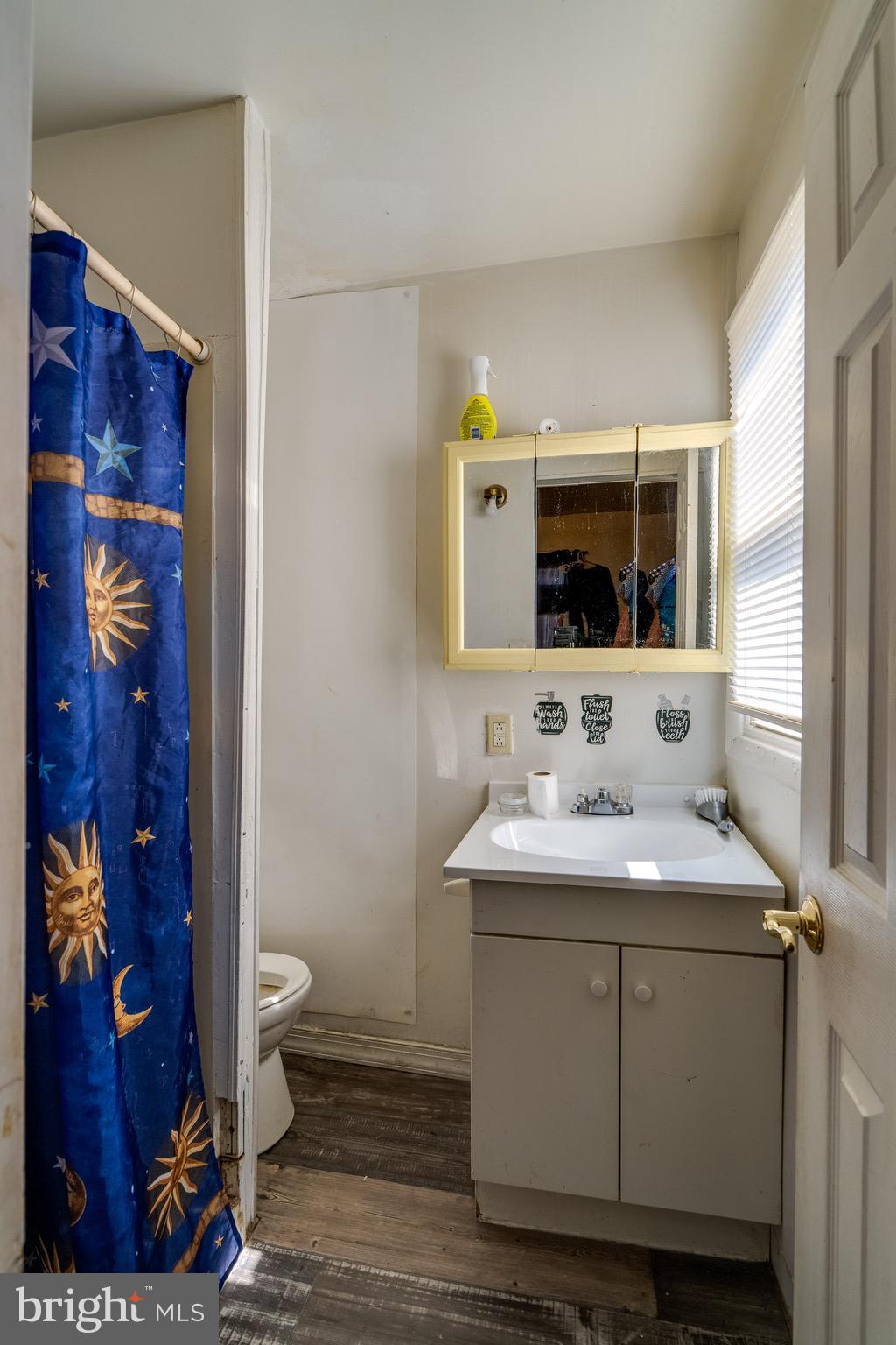 546 Poplar Street Lancaster, PA 17603 - Photo 17 of 29 a bathroom with a toilet sink and mirror