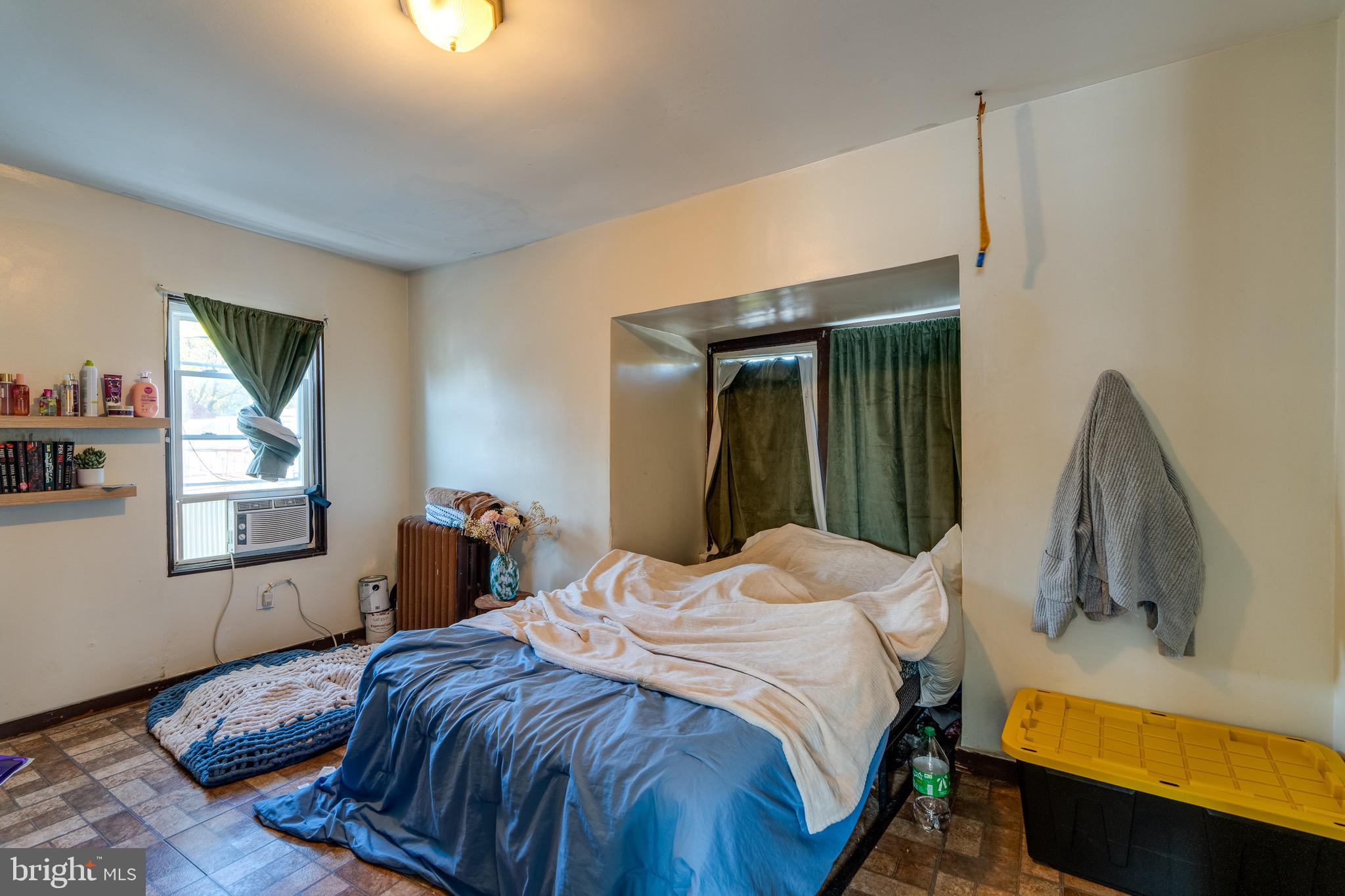 546 Poplar Street Lancaster, PA 17603 - Photo 28 of 29 a bedroom with a bed and a flat tv screen on dresser