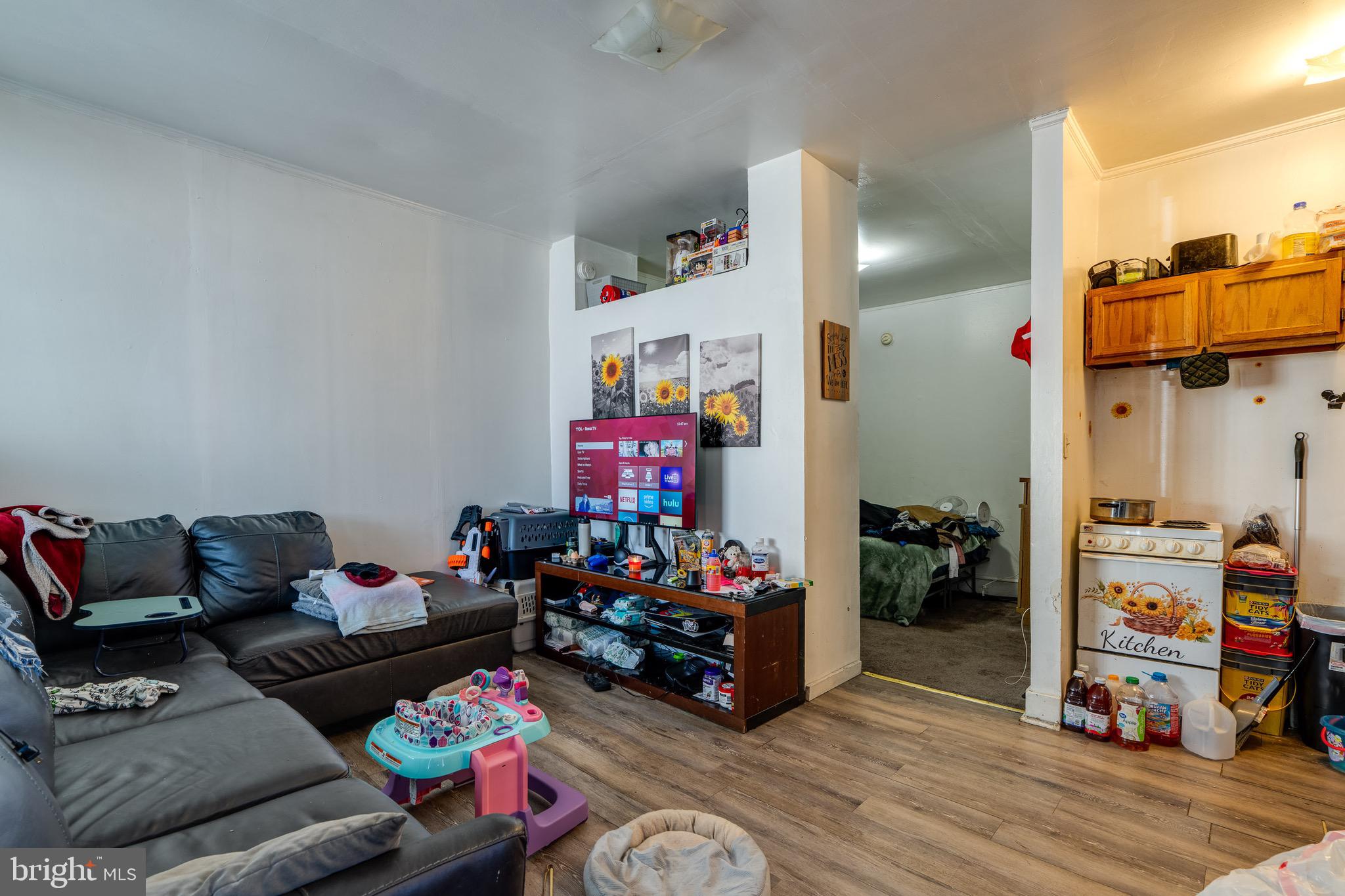 546 Poplar Street Lancaster, PA 17603 - Photo 6 of 29 a living room with furniture and a wooden floor