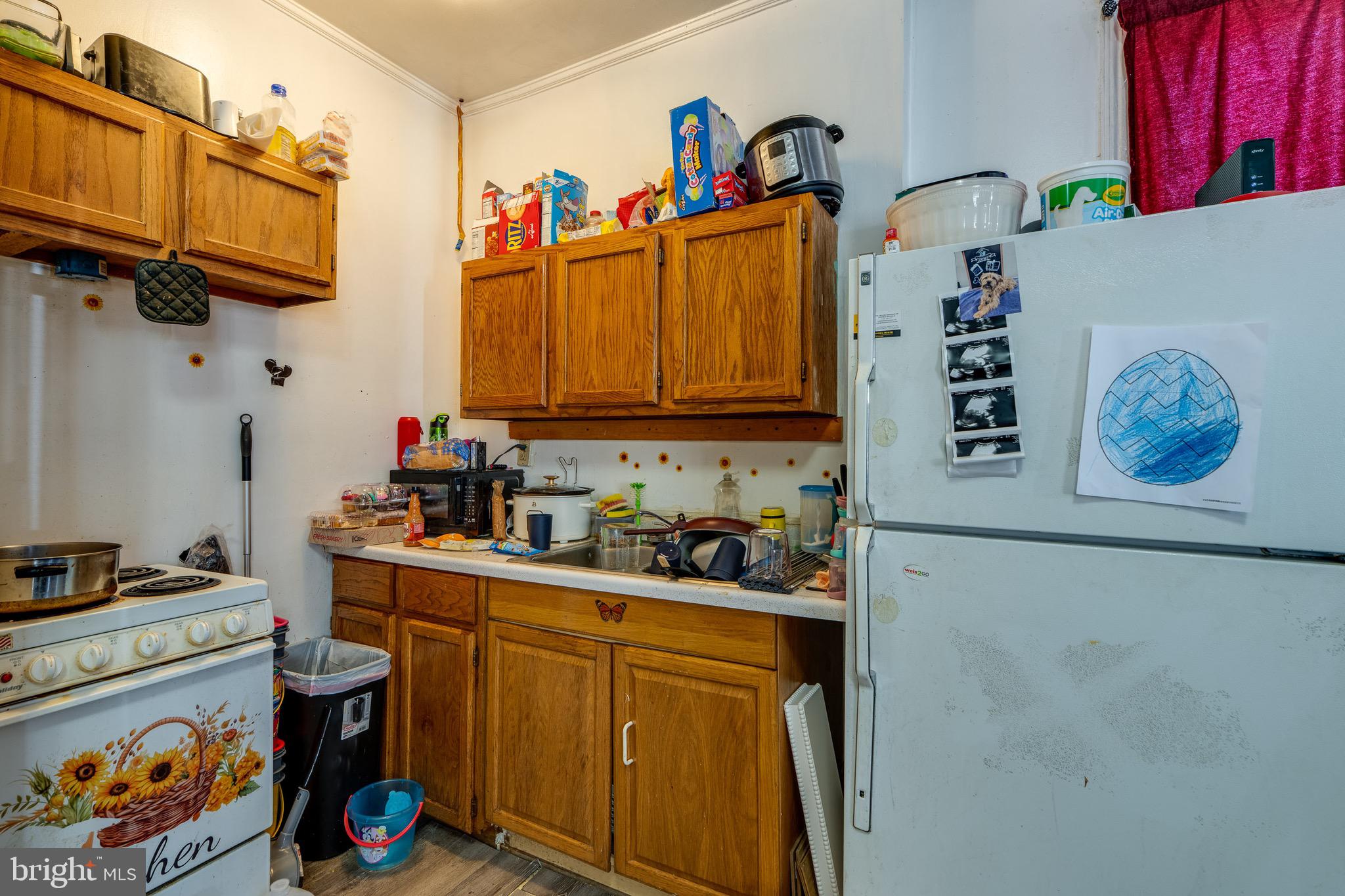 546 Poplar Street Lancaster, PA 17603 - Photo 8 of 29 a kitchen with stainless steel appliances a stove a sink and cabinets