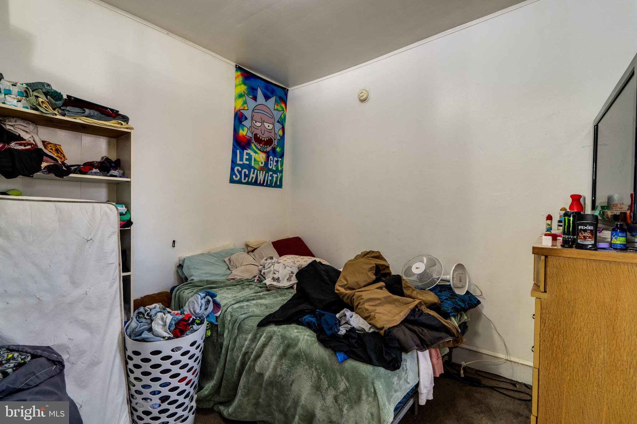 546 Poplar Street Lancaster, PA 17603 - Photo 9 of 29 a bedroom with a bed and a couch