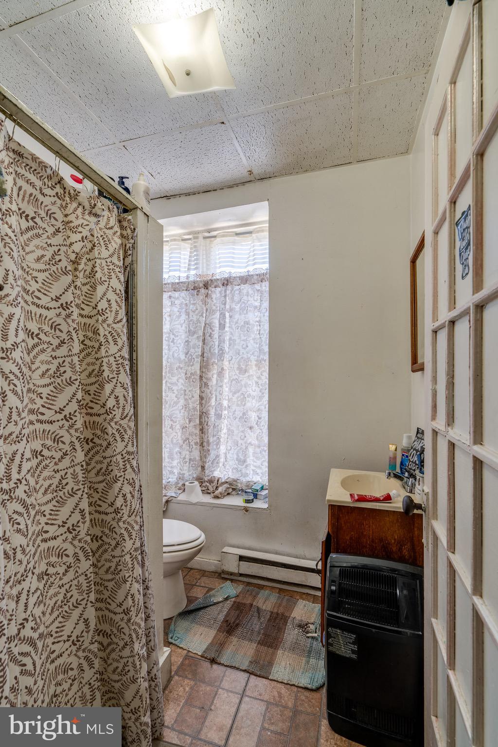 546 Poplar Street Lancaster, PA 17603 - Photo 10 of 29 a room with a wooden floor and a chair