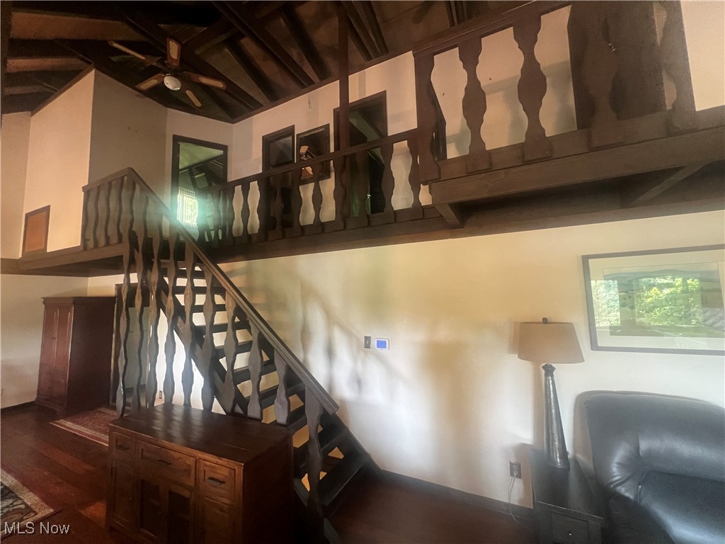 86301 North Bay Road Scio, OH 43988 - Photo 14 of 50 Stairs with hardwood / wood-style flooring, a towering ceiling, and ceiling fan