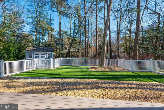 a large kitchen with a table and chairs