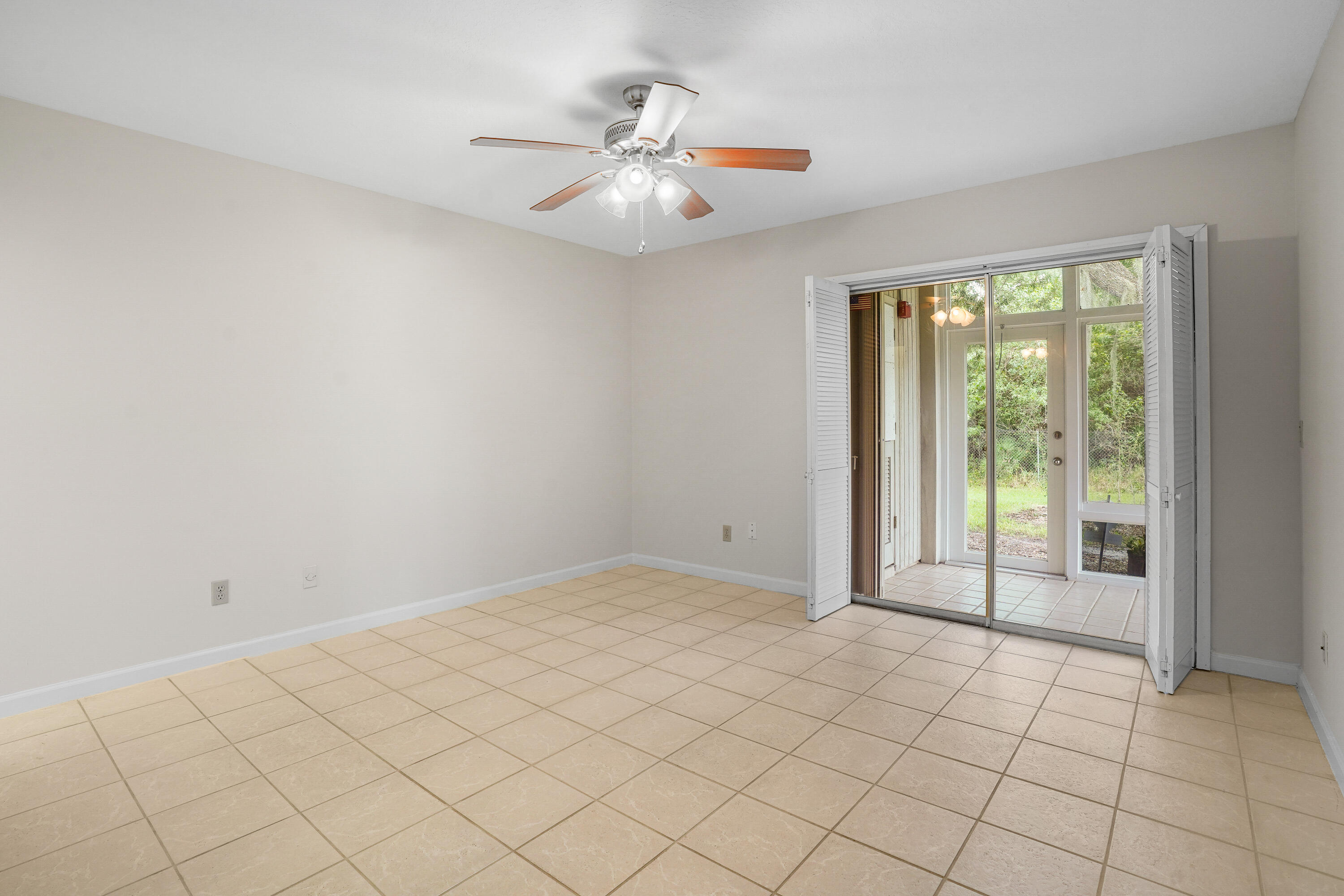 23 Lake Vista Trail, Unit 101 Port St. Lucie, FL 34952 - Photo 15 of 24 a view of an empty room and window