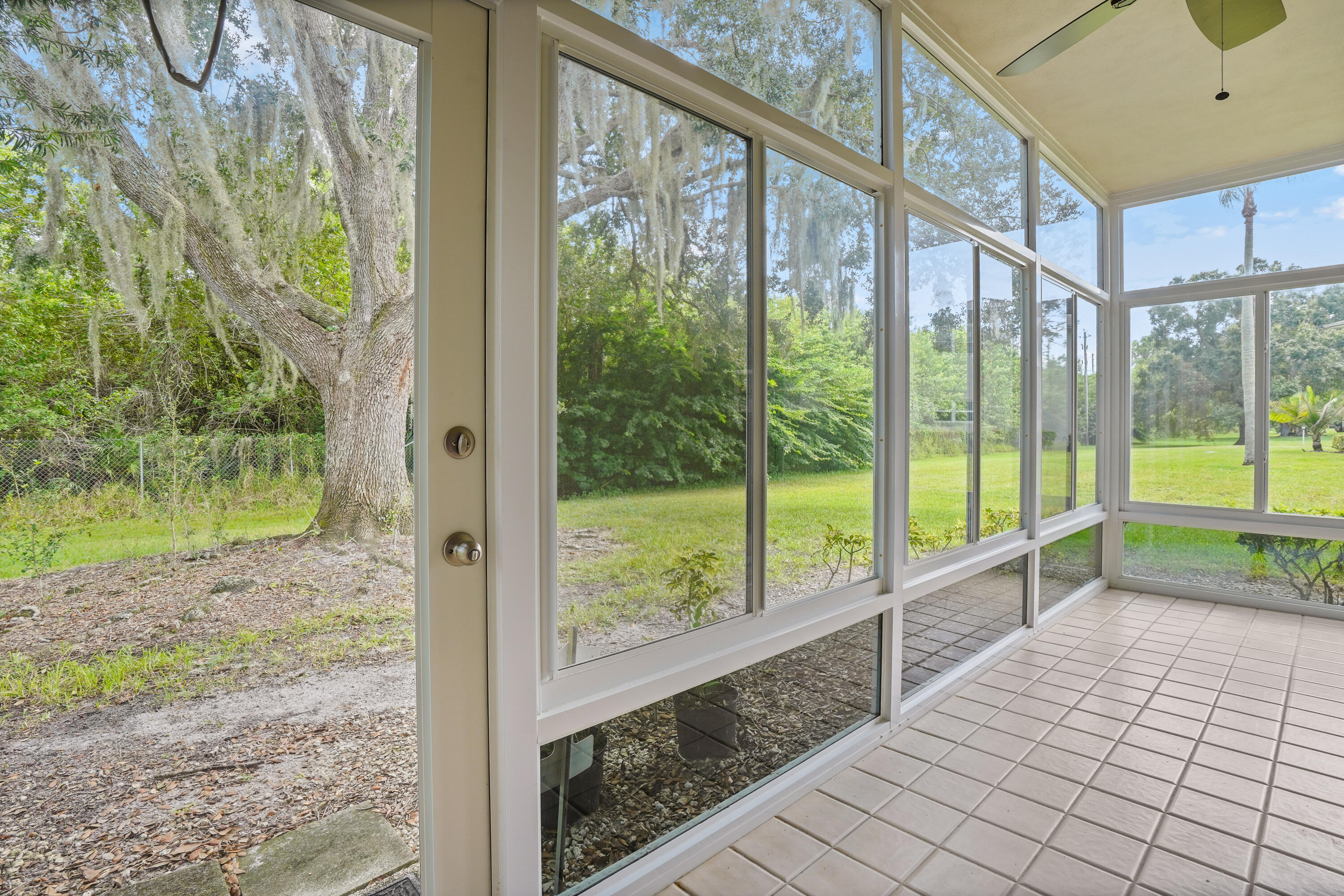 23 Lake Vista Trail, Unit 101 Port St. Lucie, FL 34952 - Photo 19 of 24 a view of a porch with a yard