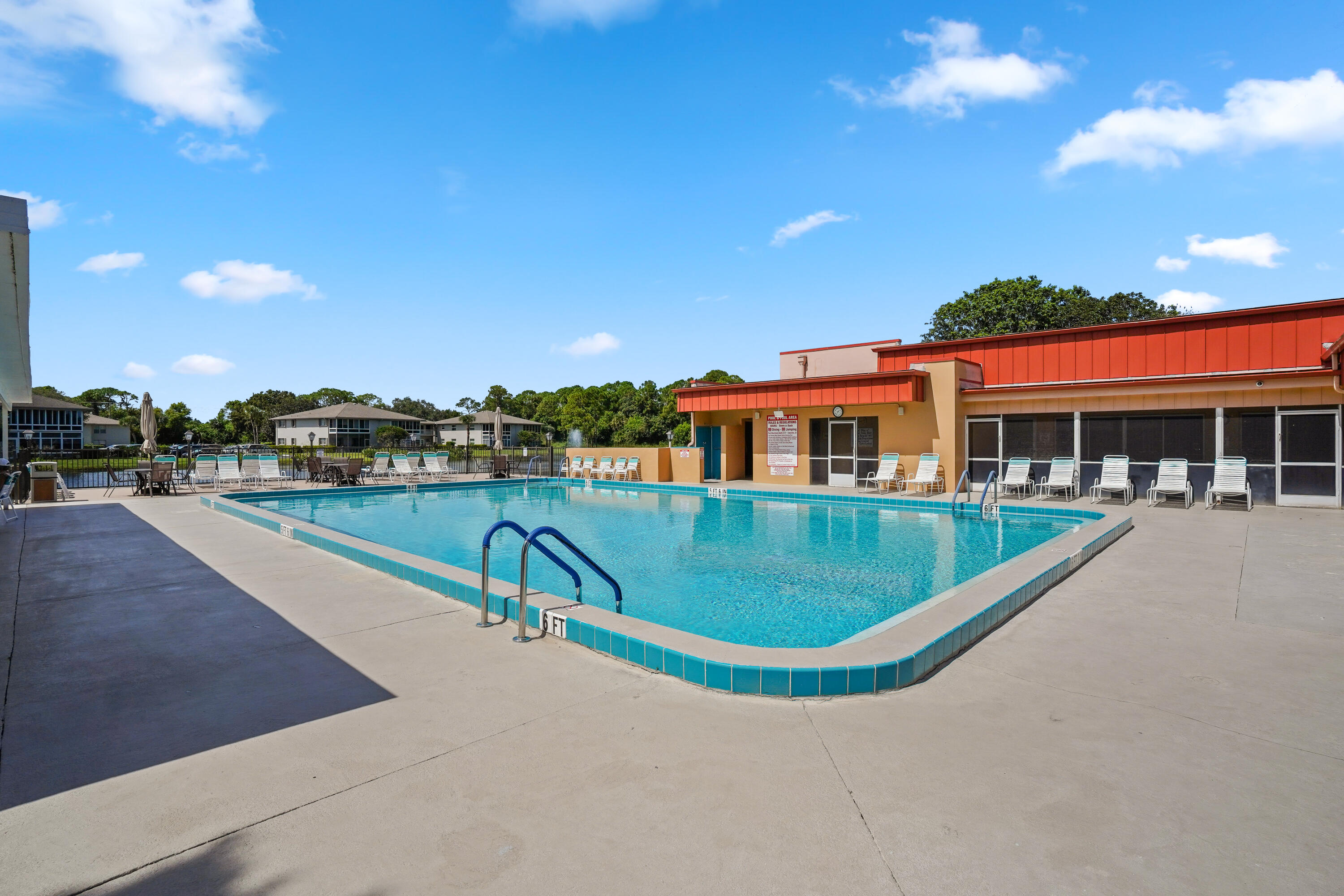 23 Lake Vista Trail, Unit 101 Port St. Lucie, FL 34952 - Photo 24 of 24 a view of a house with swimming pool