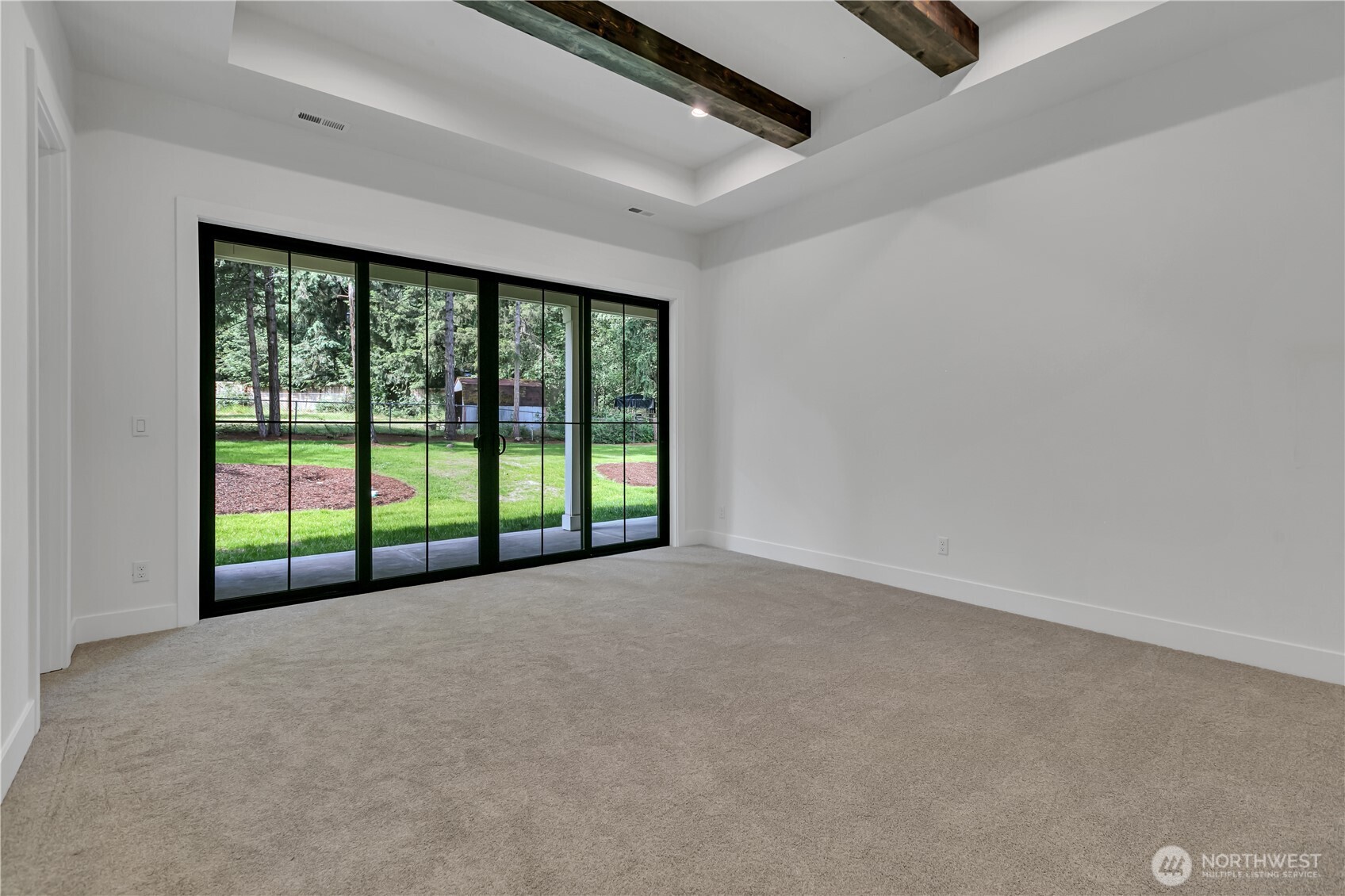 6709 254th Street East Graham, WA 98338 - Photo 18 of 40 a view of an empty room with a sliding door